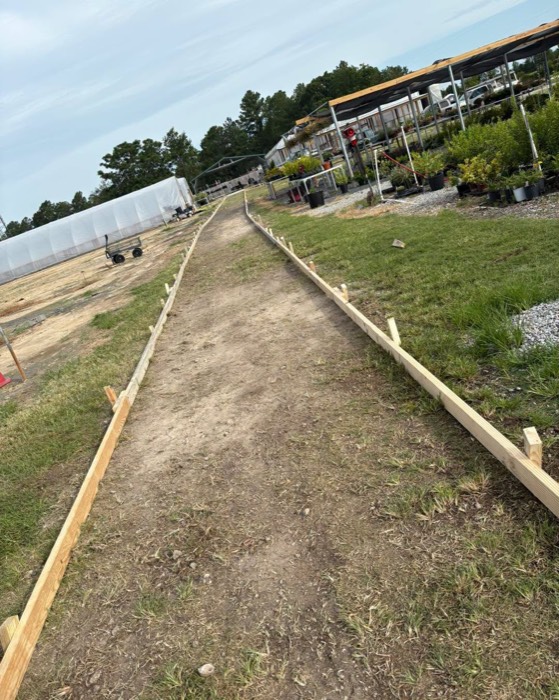 A new walkway being staked out at B's Greenhouses