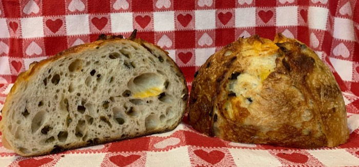 A jalapeño cheddar sourdough loaf from Farm Girl Bakery, cut open
